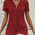 Uzziora – Polka Dot V-hals bluse med lynlås